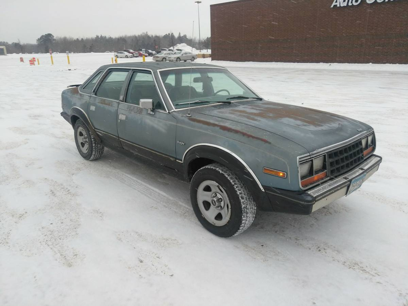 Illustration for article titled Any one want an old XJ Sedan with a Landua Top and a Spoiler?